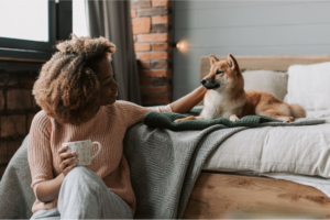 Pet owner calming her pet dog